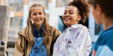 group of young kids laughing outside