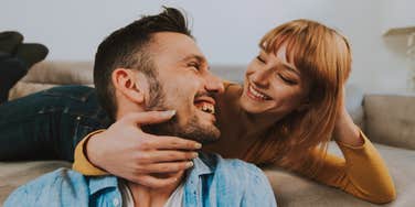happy faithful woman looking in partner's eyes smiling