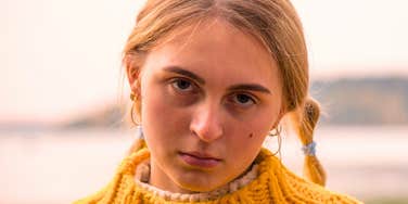 stubborn young woman looking annoyed and angry