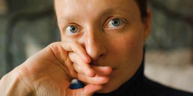 woman who isn't OK at all despite acting normal