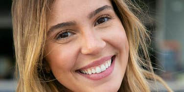 Woman is with a good man who tries to make her smile.