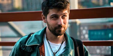 Man standing outdoors, facing forward but looking off to the side, illustrating missing key traits that chemistry alone can’t fix in a relationship