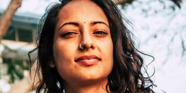 beautiful woman with a rare soul type standing outside