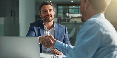 men shaking hands in interview