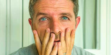 stressed man feeling overly pressured due to childhood experiences