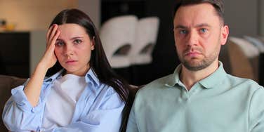 upset couple sitting next to each other learning lessons too late