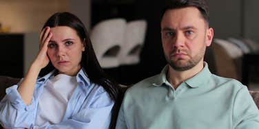 sad couple who are financially stressed