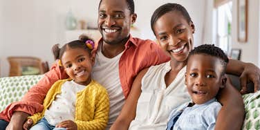 happy family with parents who enforce rules to raise healthy kids