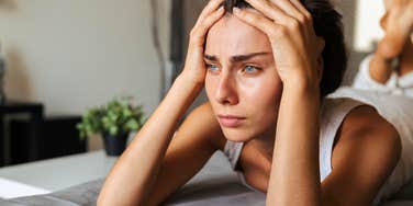 intelligent woman stressed after regretting making plans