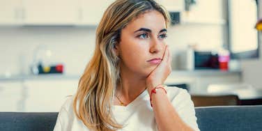 forgetful young woman thinking at home