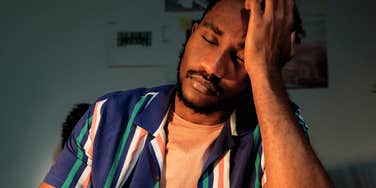 tired man struggling after night of not sleeping well 