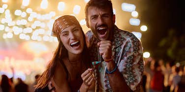 couple singing along at concert