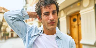 real and genuine man looking a bit awkward and unsure