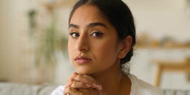 woman who doesn't fit in anywhere being observant