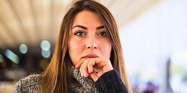 Woman who lacks personal boundaries looking stern 