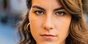 sinister woman out to get others looking suspicious