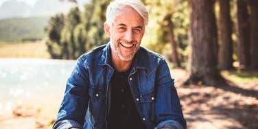 Happy middle-aged person outdoors in the morning, illustrating healthy morning habits for long-term wellness