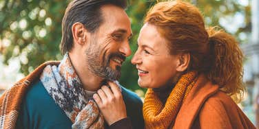 man deep in love with his wife staring at her smiling