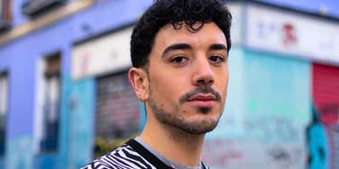 young gen z man standing outside