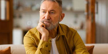 older man sitting alone after losing his wife and kids by dumb decisions