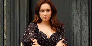 Confident woman standing with arms crossed, illustrating situations where you don’t have to be the bigger person because life is too short