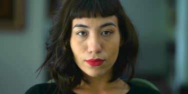 serious woman who doesn't trust anyone