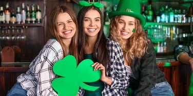 three women dressed in green celebrating st. patrick's day