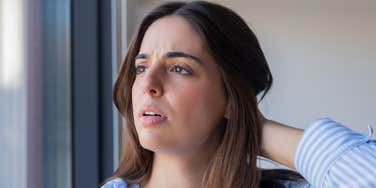 Attractive woman faces a hidden social reality.