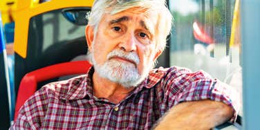 Mature Baby Boomer with a sad expression, illustrating the quiet pain of no longer feeling needed by everyone