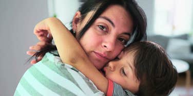 A mother and little boy sharing an authentic, loving moment, capturing the vital importance of a mother's well-being and its direct impact on her ability to parent effectively.