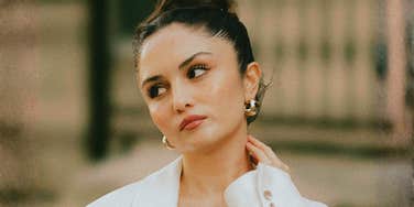 A woman looking weary and staring off to the side, illustrating the 'slow erosion' of friendship and the subtle signs of a one-sided relationship.