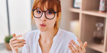 High IQ woman talking in an office trying to change minds and win arguments