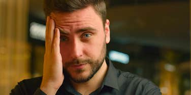 stressed man unsure why he's anxious standing outside