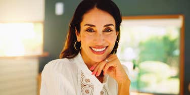 legitimately sophisticated woman smiling confidently