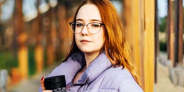 A candid, relaxed Gen Z woman outdoors, representing the shift in mindset as younger generations rethink traditional marriage and societal expectations.