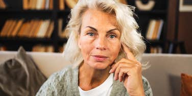 A confident woman in her sixties enjoying time at home, representing the freedom, empowerment, and new opportunities that define life for many women in their fifties and sixties.