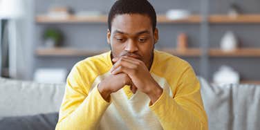 man feeling lonely at home