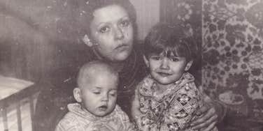 mother in the 1960s sitting with her children