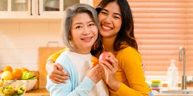 mom who has her child's best interests hugging and smiling her daughter