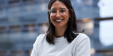 Woman smiling because she's capable of anything she sets her mind to