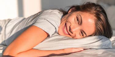 woman feeling well rested after getting only a few hours of sleep