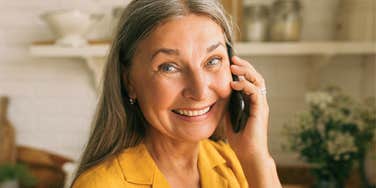 People Who Still Like To Talk On The Phone Instead Of Texting Usually Have These Increasingly Rare Personality Traits happy older woman who still likes to talk on the phone instead of texting