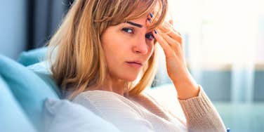 upset woman going silent sitting alone