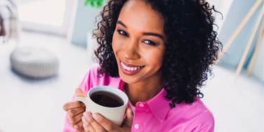 young woman who is stronger than normal people drinking black coffee in the morning