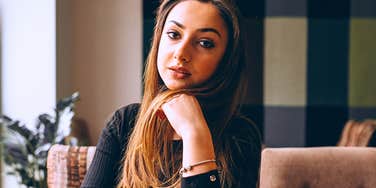 Woman who is too easily offended in a restaurant looking annoyed