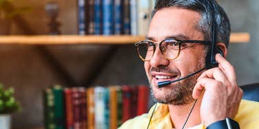 man working customer service with a headset on
