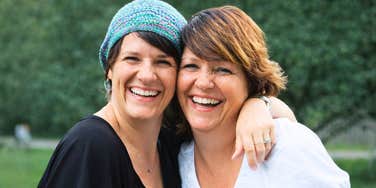The author with her mother, capturing a moment of joy that highlights the complex reality of maintaining positivity during challenging life transitions.