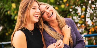 A mother and daughter bonding at a park, capturing authentic connection that help mothers align with their values.