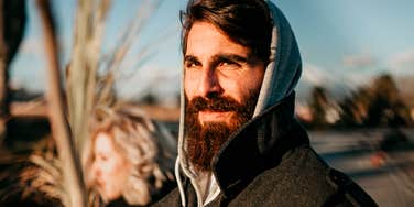 A portrait of a man looking directly at the camera, representing the isolation and struggle many men face when navigating the modern "friendship recession."