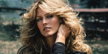 A confident single woman in 1970s fashion, wearing a stylish blouse and looking empowered, representing the "bold" shift of female characters on 1960s and 1970s television.